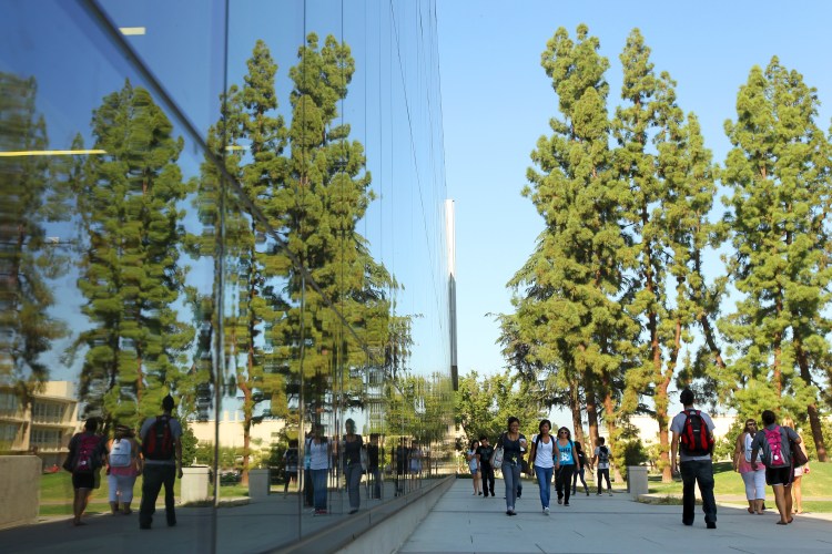 Students walking by the Library