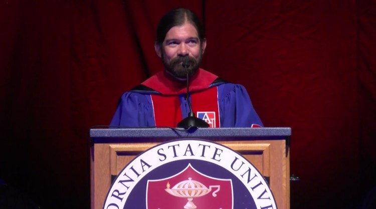 Screenshot of MCJ Professor Jes Therkelsen giving keynote speech about curiosity at New Student Convocation
