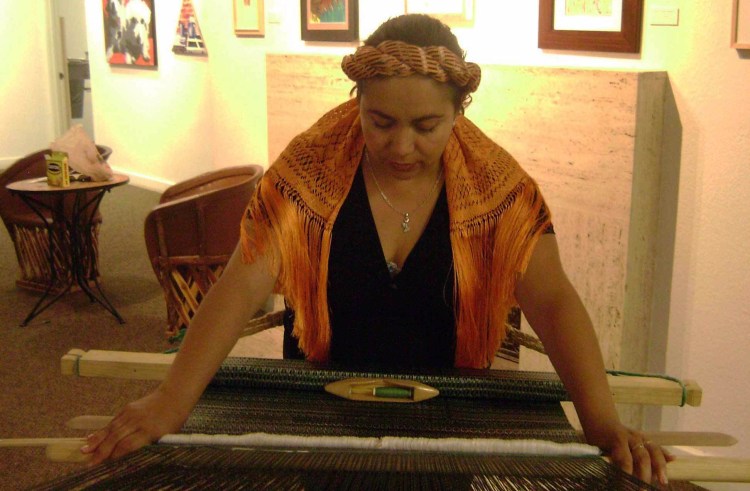 Woman weaving a rebozo