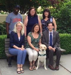 Carol and her trainee Glow with the Dean's Office staff.
