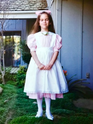 Cassidy Smith in the dress her mom made for her 1996 Peach Blossom performance