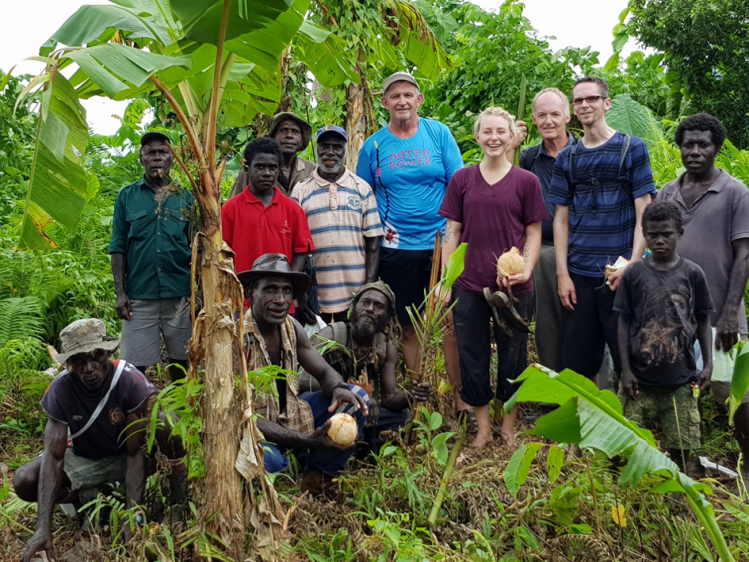 Dr. Jason Brown (third from right) and his team, a group of Naasioi elders and community members on an ethnobiological expedition in Bougainville, collect photographs and record the Naasioi names of plants and animals.