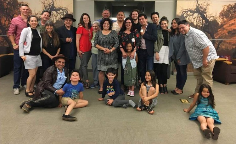 Multiple generations of the Montoya family gather outside the Table Mountain Rancheria Reading room inside the Henry Madden Library on campus, after the symposium's closing.