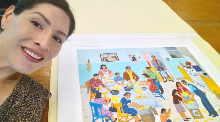 Dr. Melanie Hernandez with an original print of Carmen Lomas Garza's lithograph "Tamalada"