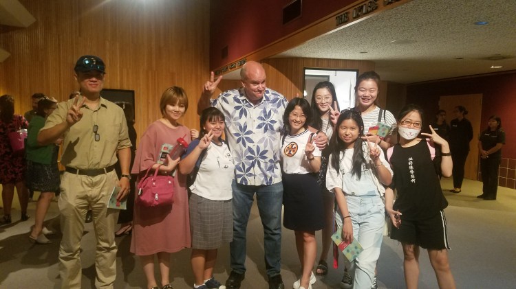Former TV news photojournalist, Professor of Practice at the Newhouse School in Syracuse, and CSU Summer Arts program guest artist Les Rose poses with students visiting from China.