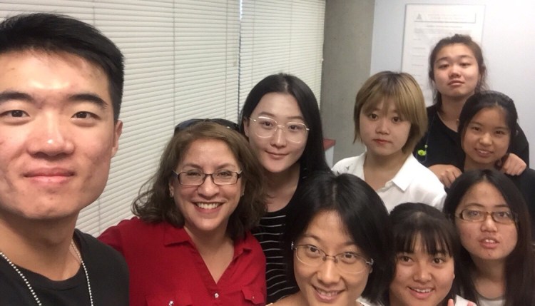 Beijing Union University students pose with Fresno State's Dr. Kelly McCoy