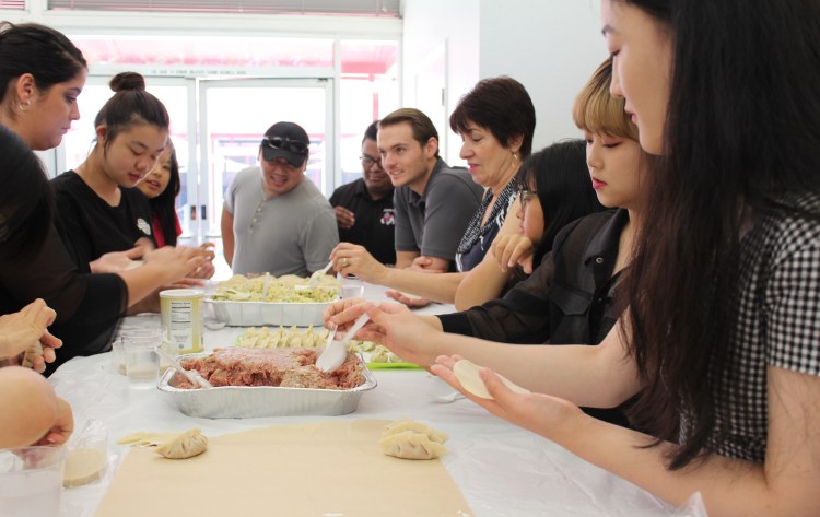 Beijing Union University students and Fresno State faculty and staff work together to make a festive farewell lunch on Wednesday, August 8th.