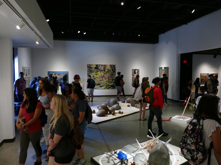 Students visit the Faculty Art Show