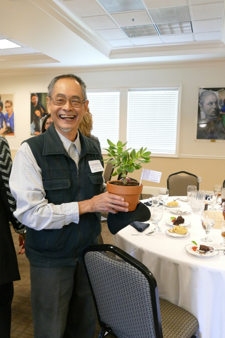 Dr. Cheng Lok Chua holds his new plant