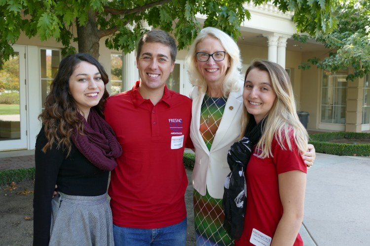 Students Marissa Mata, John Spankowski, and Tess Lopes-Medina pose for a photos with Associate Dean Honora Chapman.