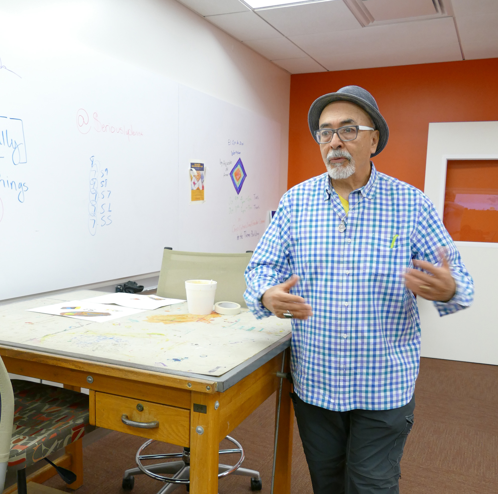 Juan Felipe Herrera talks about the old drafting tables used in the Laureate Lab.