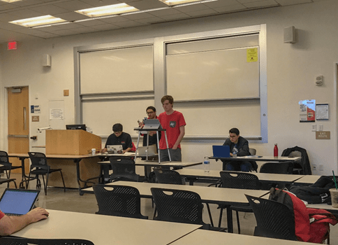 Kyle Zoldoske (at podium) and Jose Aceves (right) during cross-examination in the final round against UNLV