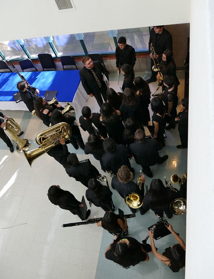 High school students prepare to take the stage for a Friday morning performance at the 40th Annual Dr. Lawrence R. Sutherland Wind Festival.