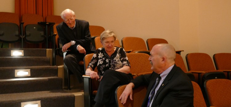 Dr. Gary P. Gilroy (right) talks with adjudicators Susan Hamre (center) and Dr. Thomas Lee (left) between performances.