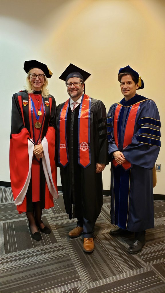 Associate Dean Honora Chapman (left) and Dean Saúl Jiménez-Sandoval (right) welcome National Endowment for the Humanities Chairman Jon Parrish Peede.