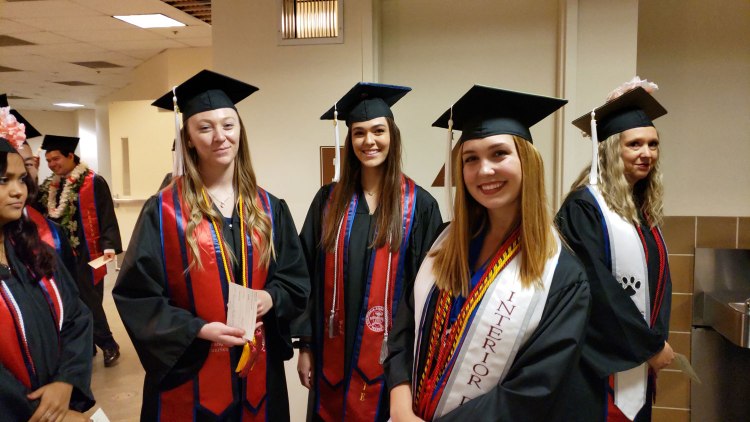 Graphic design grad Kristin Bonillas (left) lines with other Art and Design students ahead of CAH Convocation.