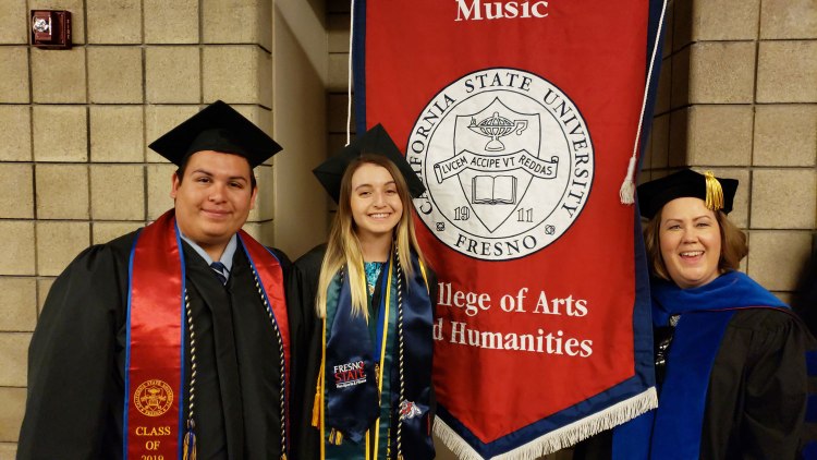Student of distinction Theresa Lopes (center) with her husband Anthony Perez (left) with faculty Standard Bearer Emily Mason (right).