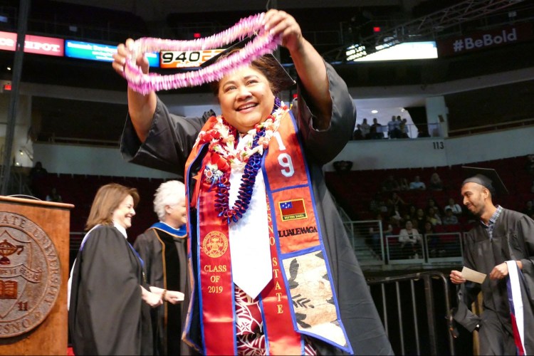 CAH student celebrates with a lei.