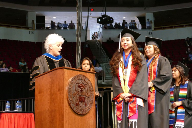 Dean's Medalist Primavera Leal Martinez receives her Bachelor of Arts in English. Martinez was later awarded the President's Medal during Commencement.