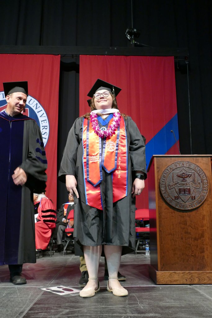 Student of Distinction Megan Evans receives her Master's of Arts in English.