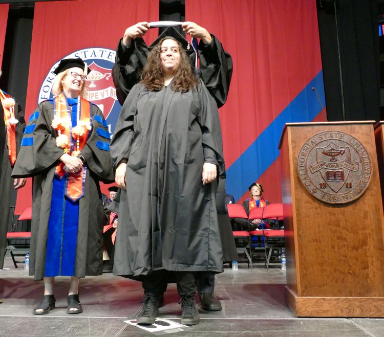 Krystal Cantú receives her Master of Fine Arts degree in Creative Writing hood.