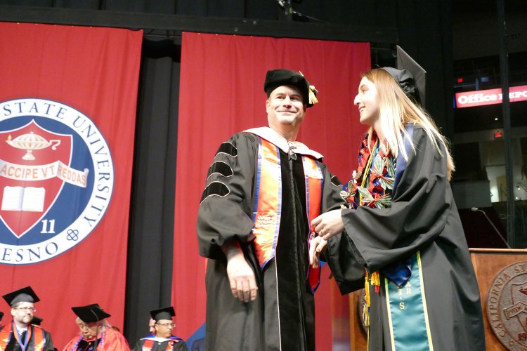 CAH Standard Bearer Theresa Lopes receives her Bachelor of Arts in Music Education with an emphasis in Choral/Vocal Education.