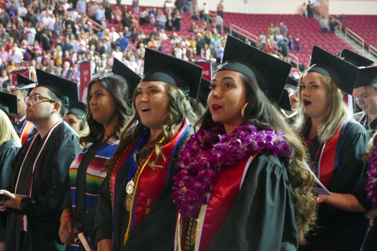 English students sing To Thee Our Alma Mater.