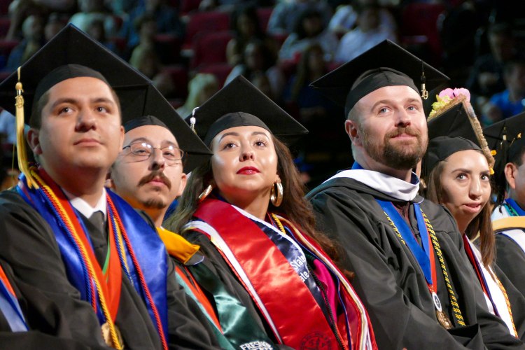 Dean's Medalist watch a video presentation highlighting their accomplishments.