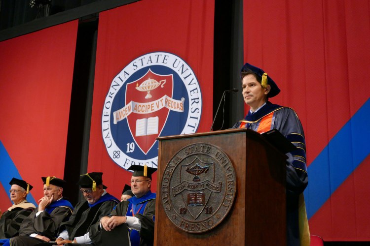 Dr. Saúl Jiménez-Sandoval acknowledges the College of Arts and Humanities graduates.