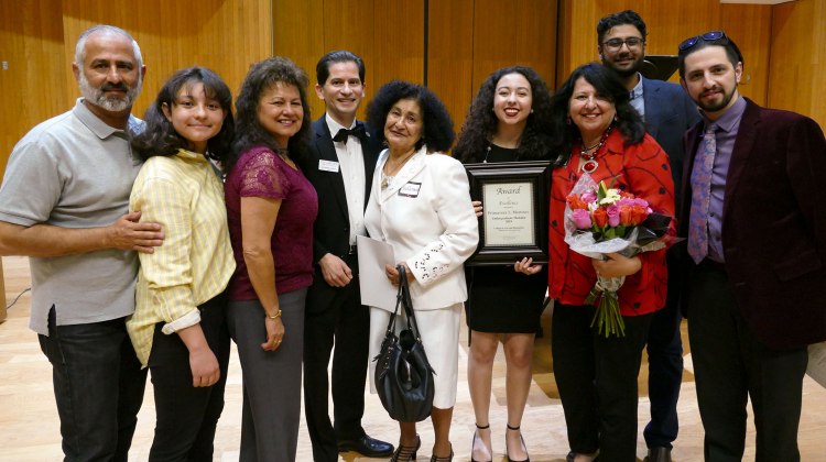 Dean's Medalist Primavera Leal Martinez with family, faculty and Dean Saúl Jiménez-Sandoval at the 2019 Arts in Motion event.