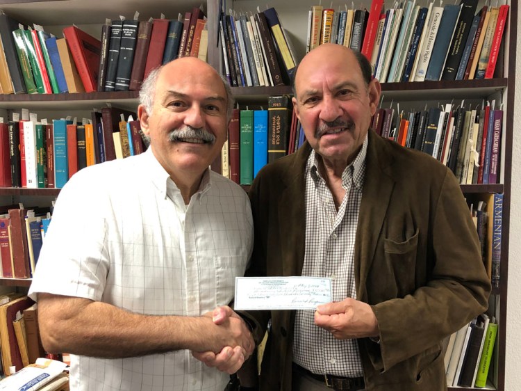 Armenian Studies Program Director Prof. Barlow Der Mugrdechian and Fresno State alumnus James L. Melikian "The Popcorn Man"