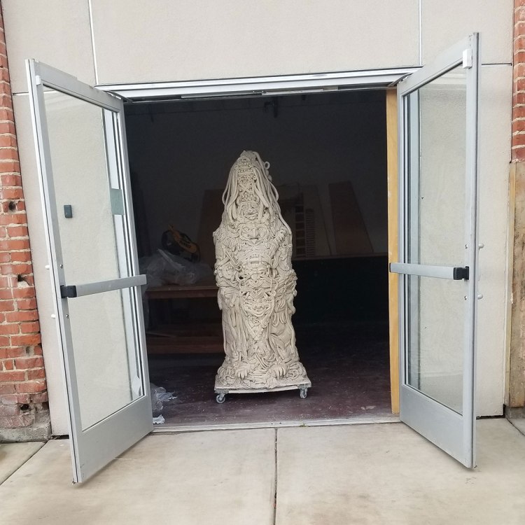 Sculpture in a doorway by Anabella Monzon