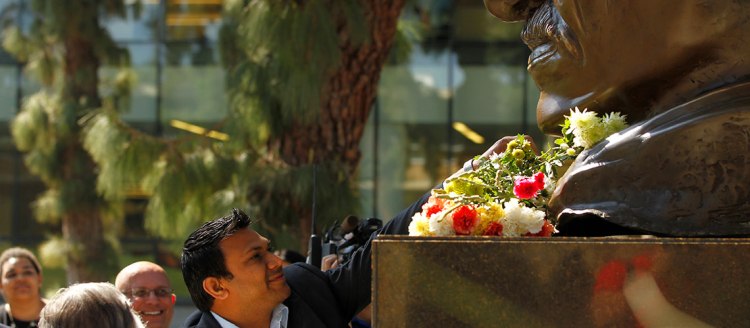 Flowers are place below the best of Gandhi in the Peace Garden. Photo by Cary Edmondson.