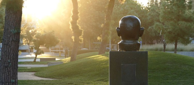 Gandhi's statue in the Fresno State Peace Garden at sunrise