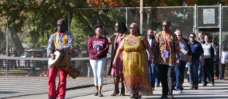 Dr. Francine Oputa and her husband Rev./Dr. Henry I. Oputa lead the procession to the mural unveiling.