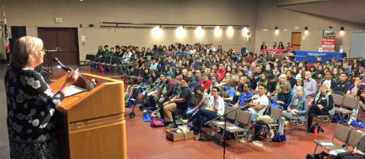 Department of English lecturer Tanya Nichols, who has coordinated the Young Writers’ Conference since 2007, welcomes area high school students and teachers to campus in 2017. Photo by Jefferson Beavers.