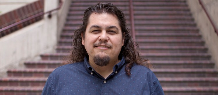 Anthony Cody in front of stairs at Fresno State.