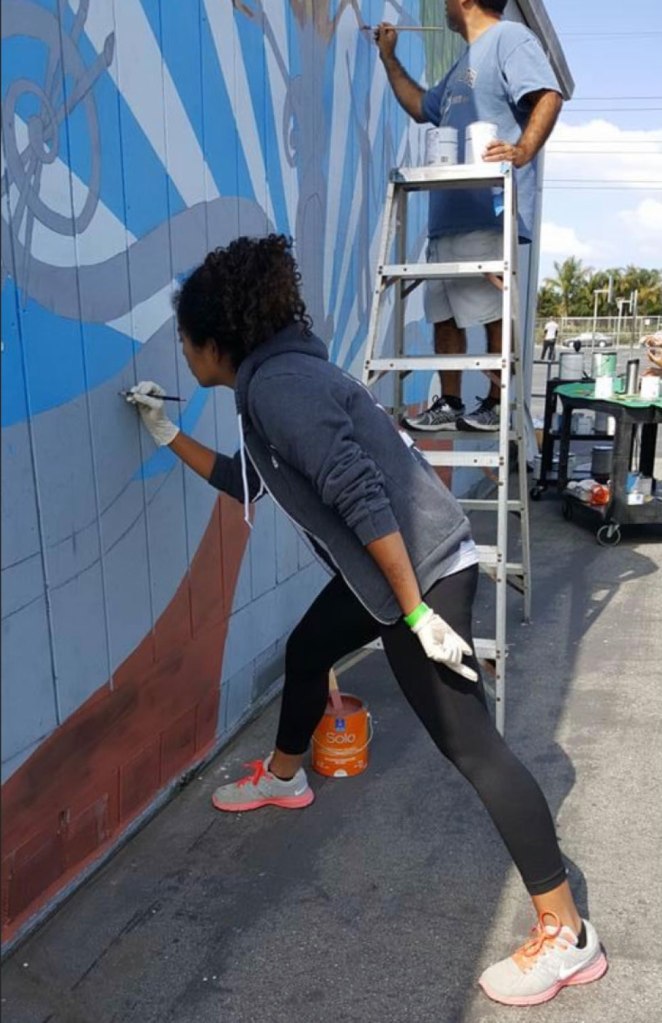 Kaelyn works on a mural in south-central Los Angeles.