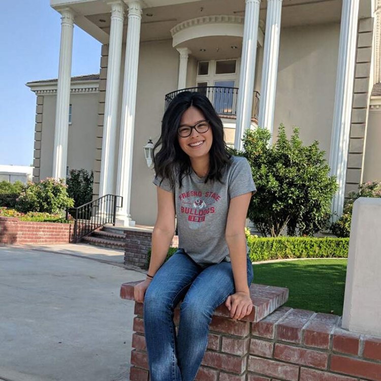 Victoria Cisneros in front of the Smittcamp Alumni House