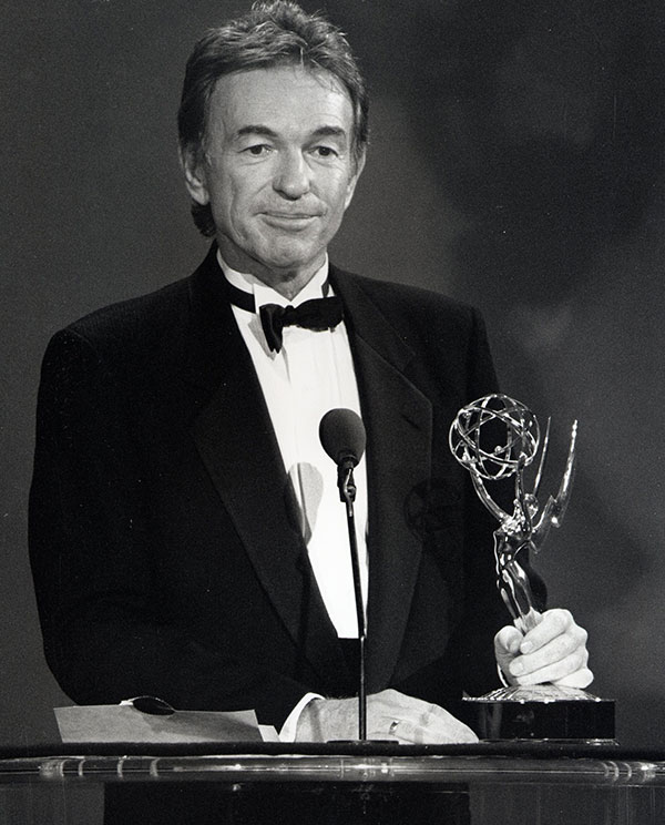 Roy Christopher with an Emmy award.