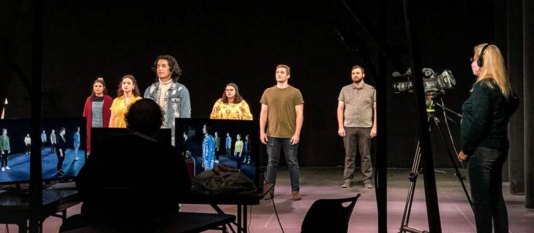 To Thine Own Self Be True actors on stage while filming in front of camera's and video monitors.