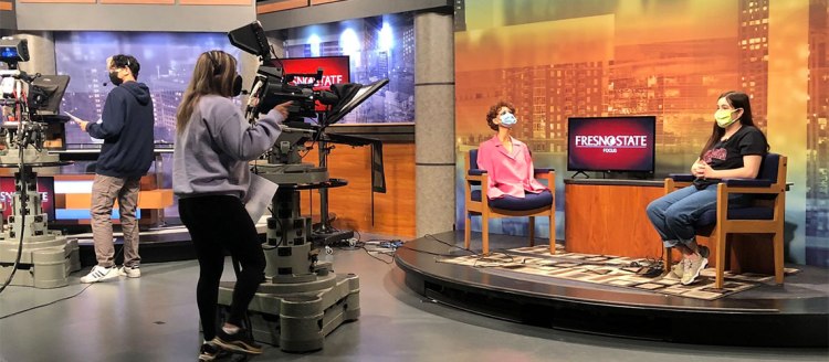 Fresno State Focus rehearses for upcoming newscast in the campus TV studio.