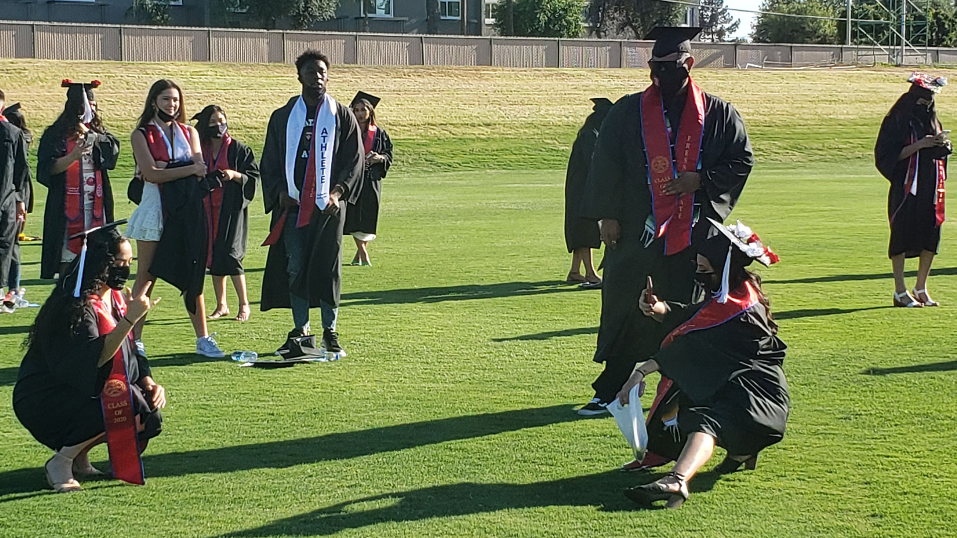 Grads pose for pictures ahead of the ceremony.