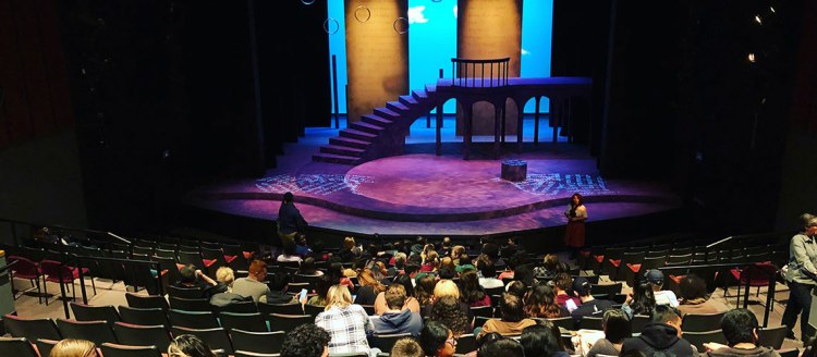 Photo from the back of the University Theatre overlooking the audience and looking onto the stage.