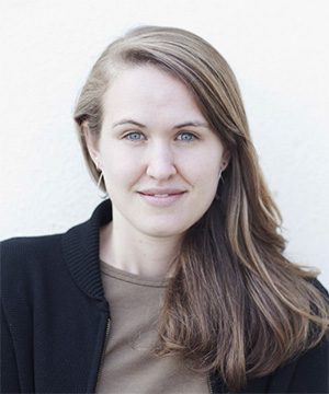 Headshot of Anna Maria Barry-Jester in a black blazer and tan shirt