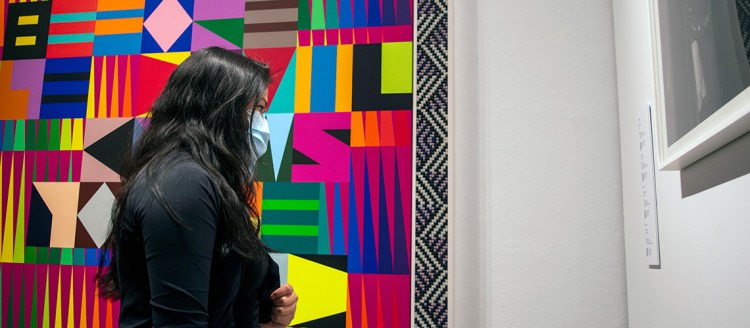 English student Rachel Cruz tours the exhibition “Nobody Promised You Tomorrow: Art 50 Years After Stonewall," inside the Phebe Conley Art Gallery at Fresno State.