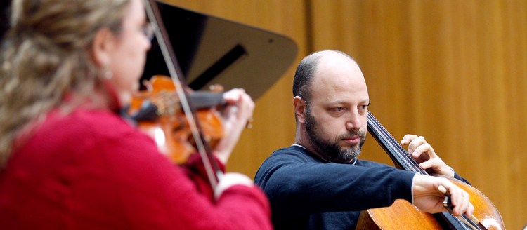 Dr. Thomas Loewenheim playing the cello.