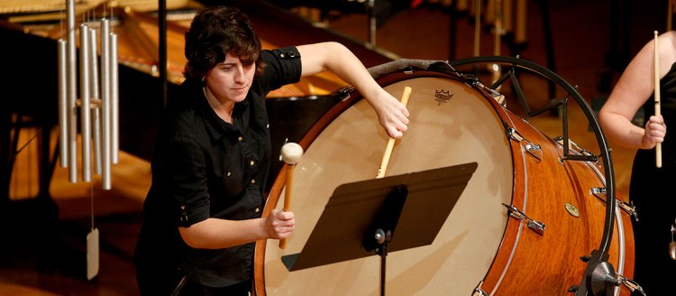 Percussion player on a large bass drum