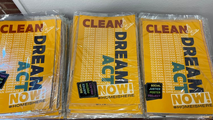 Social Justice "Clean Dream Act Now" posters along with a pack of posters were given away a the exhibition.