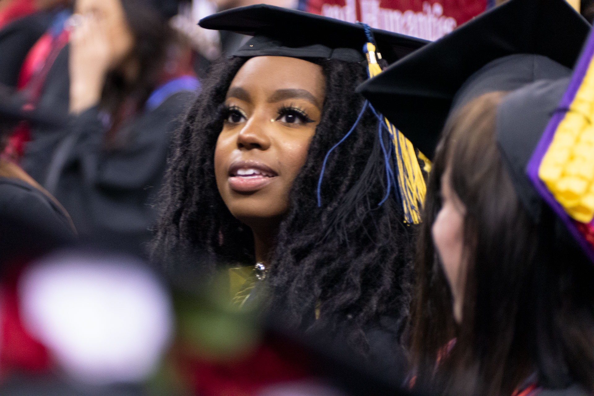 Graduate President's Medalist Audia Dixon enjoys the commencement ceremony.